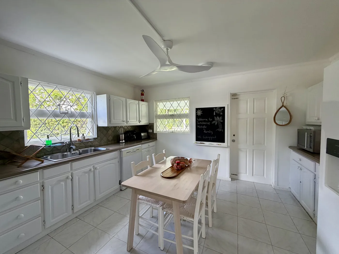 The white kitchen with a dining table