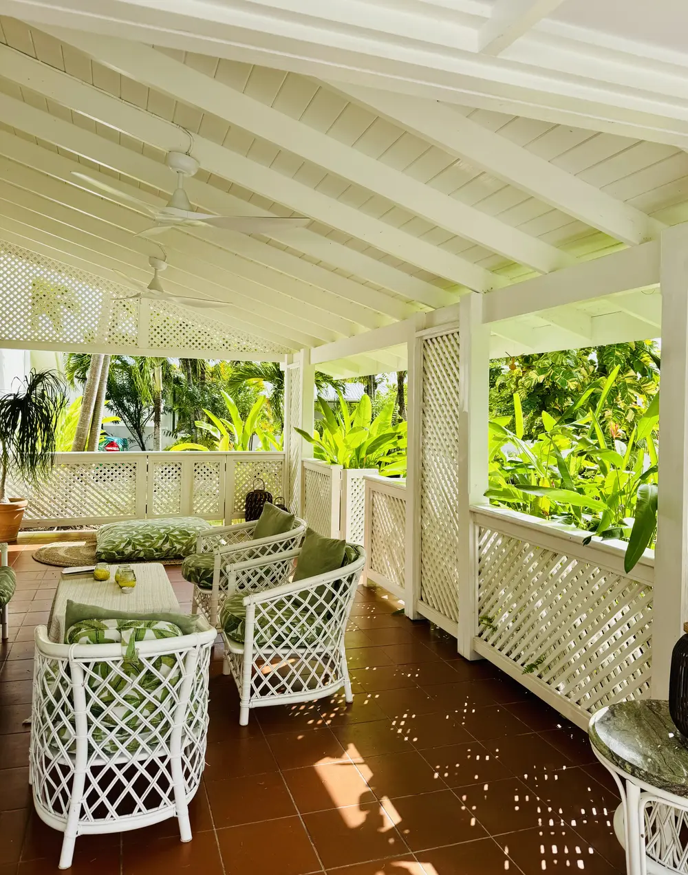 The porch with white wicker chairs